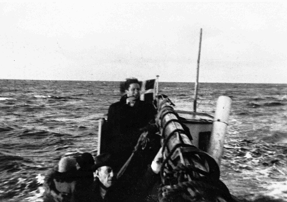 Jewish refugees aboard a small boat traveling from Falster toward Ystad in October 1943.
