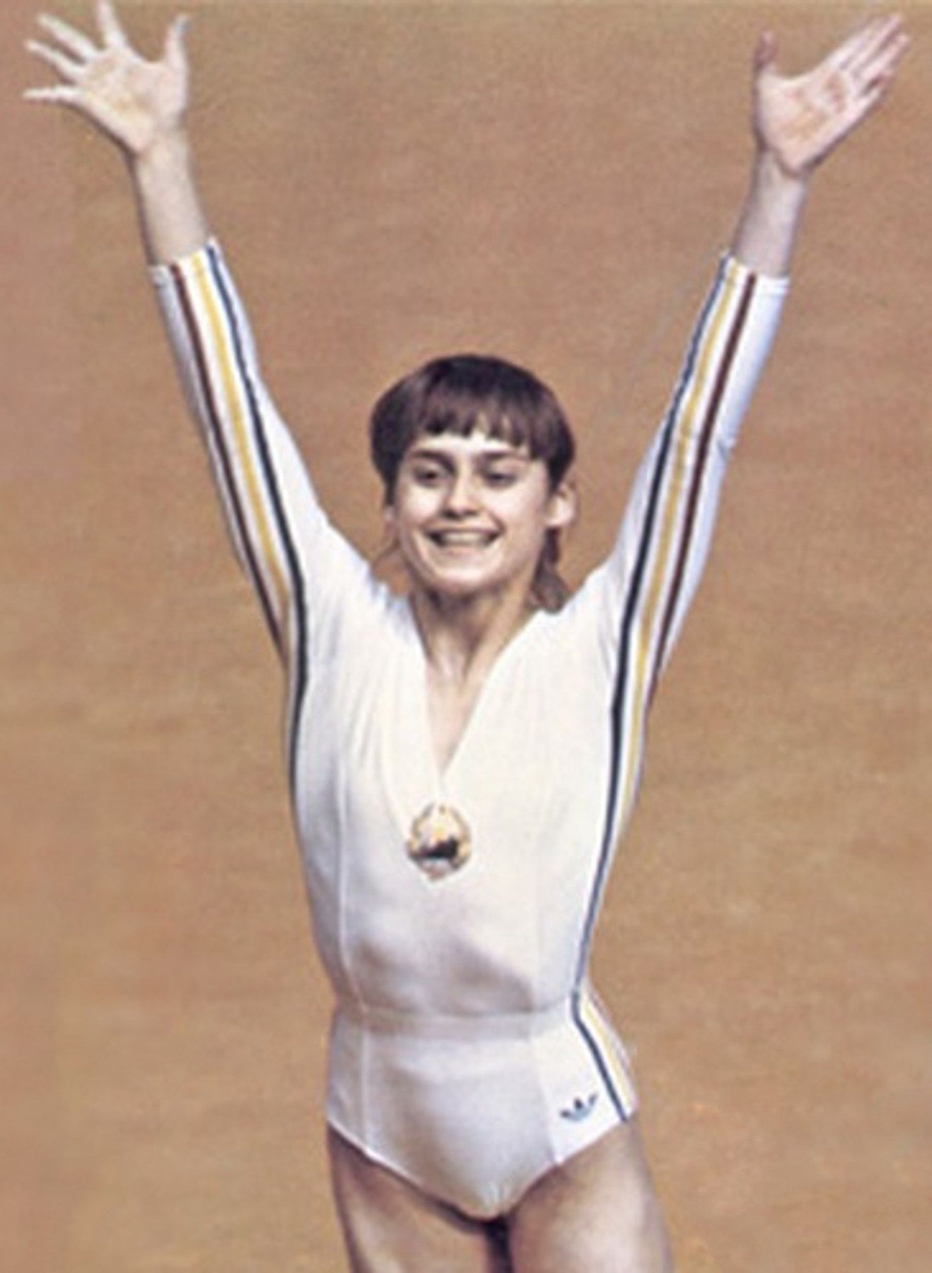Nadia Comăneci during the 1976 Montreal Olympics, wearing Romania's gymnastics uniform.