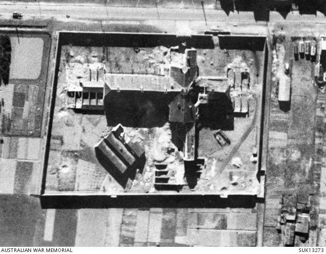 Black-and-white aerial reconnaissance photograph of Amiens prison on 23 March 1944 showing damage left by the February raid.