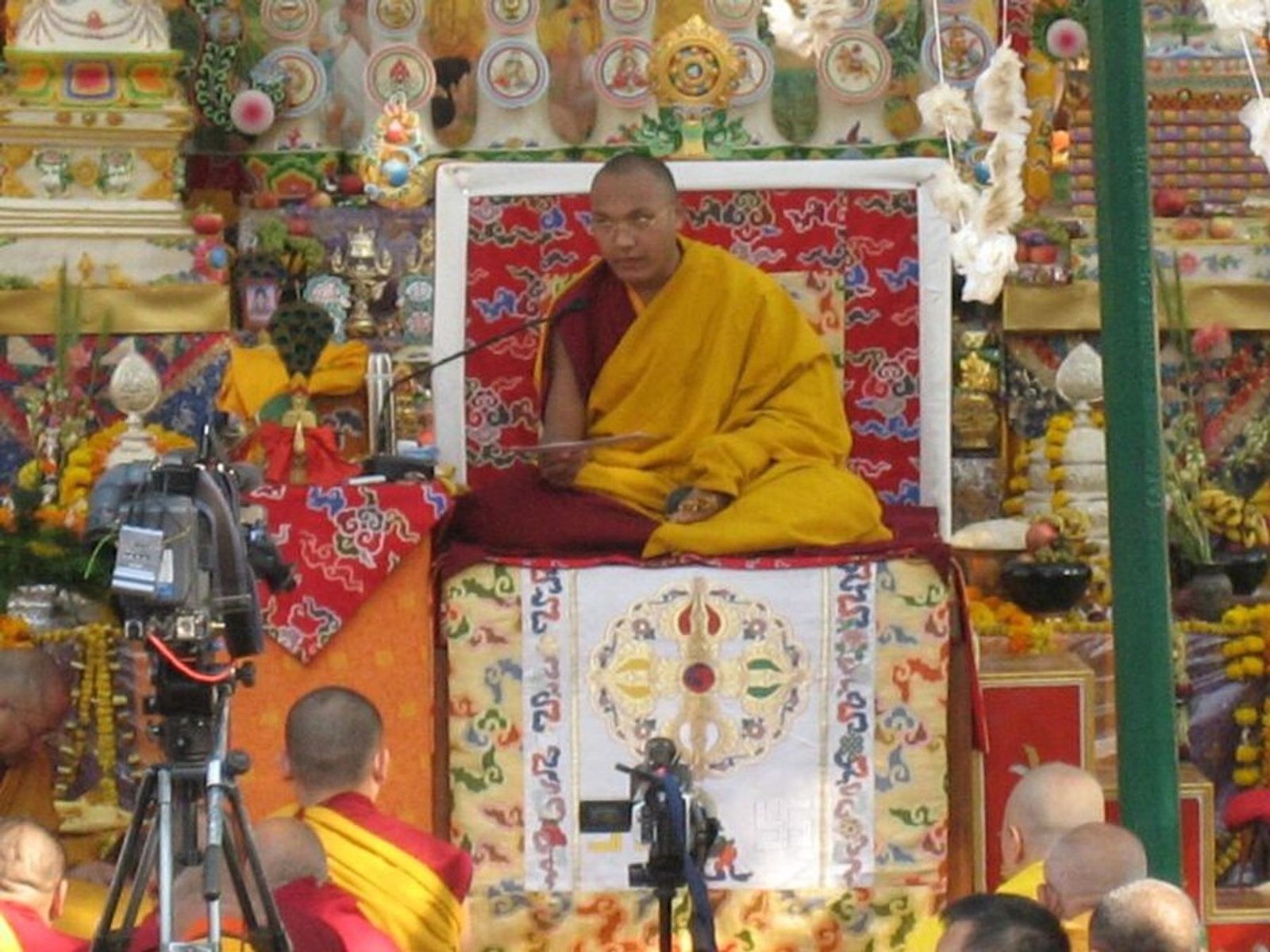 A Tibetan Buddhist lama seated in ceremonial robes during a 2006 religious event.