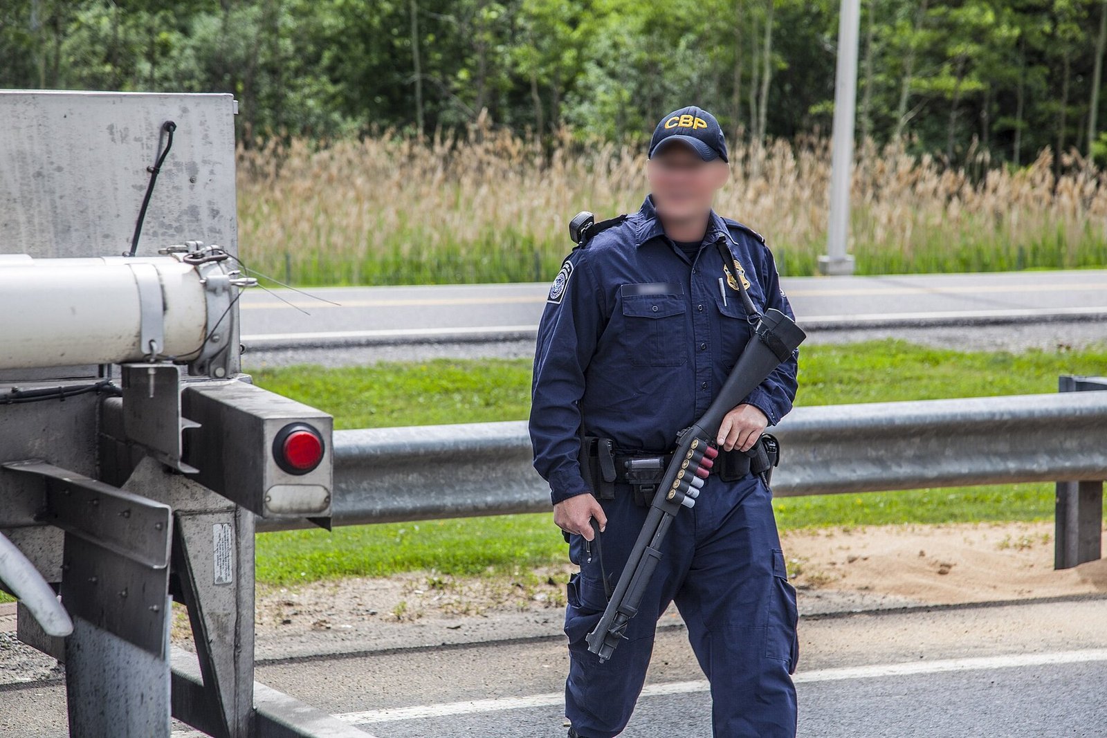 A U.S. Customs and Border Protection officer inspects a tractor-trailer during the June 2015 search for Richard Matt and David Sweat.