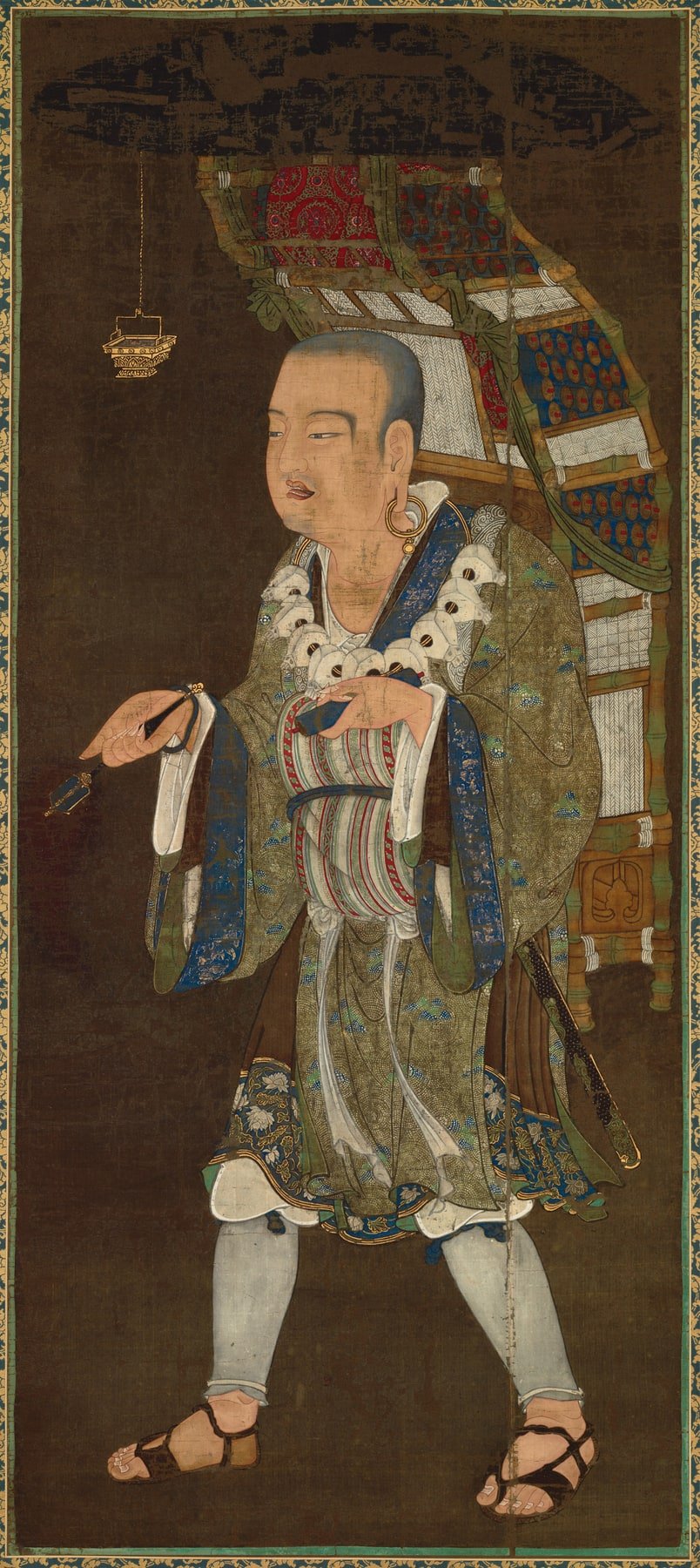 Fourteenth-century Japanese painting of the Chinese Buddhist monk Xuanzang traveling with a large pack and prayer beads.