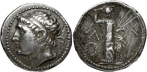 Silver tetradrachm issued under Cleomenes III, showing a diademed male head on the obverse and a cult figure on the reverse.