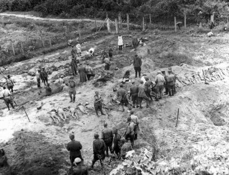 Black-and-white 1944 photograph of investigators at the former Janowska camp site in Lviv after liberation.