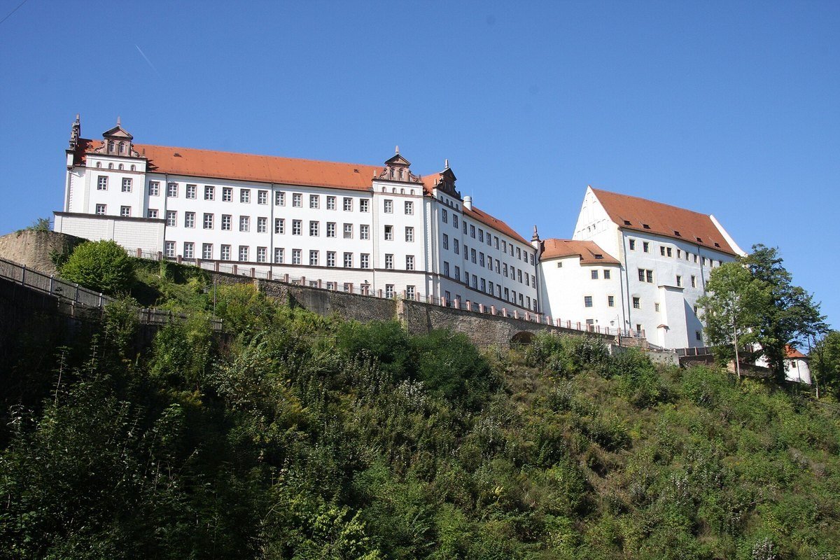 Modern view of Colditz Castle rising above the town of Colditz in Saxony, Germany.