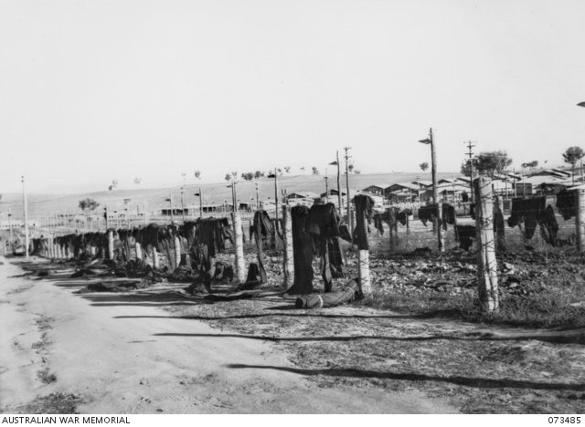 Blankets draped over barbed-wire fencing in B Compound at Cowra after the August 1944 breakout.