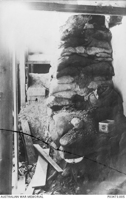 Exposed section of the Holzminden tunnel showing packed spoil bags and a ventilation pipe made from food tins.