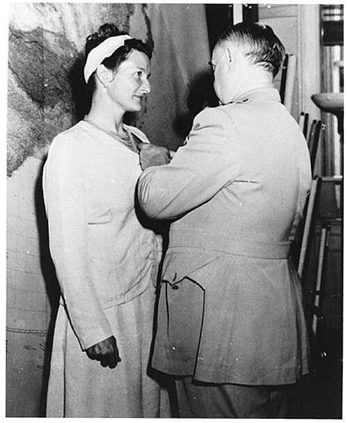 Virginia Hall receiving the Distinguished Service Cross from General William J. Donovan